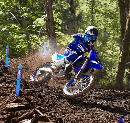 Action image of Yamaha YZ125 two stroke in Blue colourway, small roost