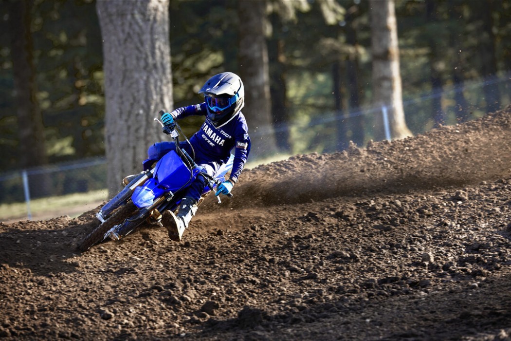 Action image of Yamaha YZ65 two stroke in Blue colourway, roosting left hand corner