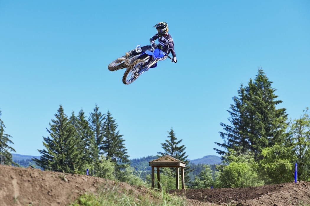 YZ250 2025 static image of motocross bike doing whip over jump