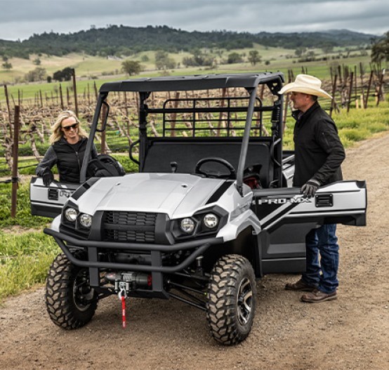 Outdoor image of Kawasaki Mule Pro MX-SE, with two farmers working on vineyard