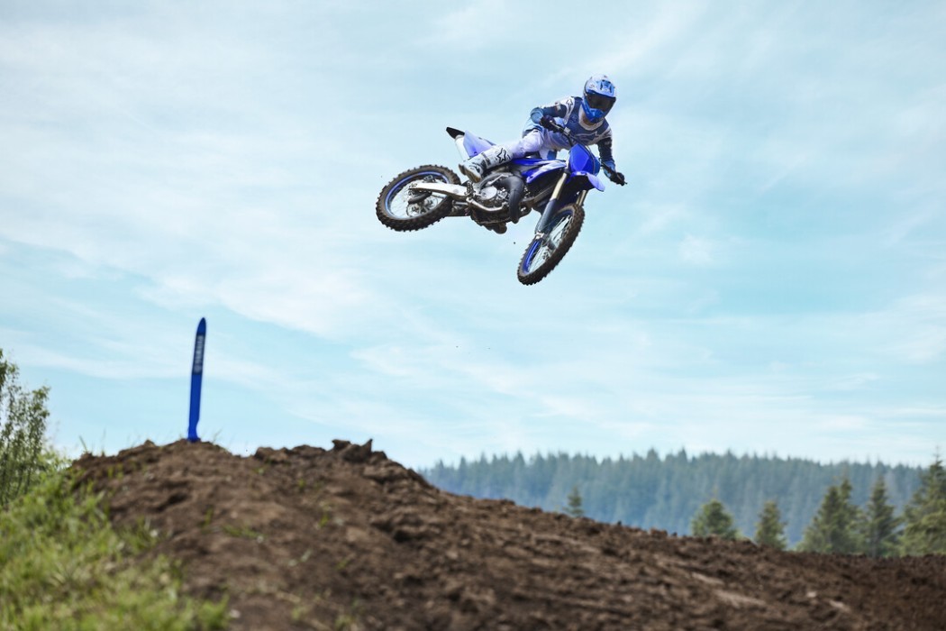 YZ125 2025 static image of motocross bike doing whip over jump