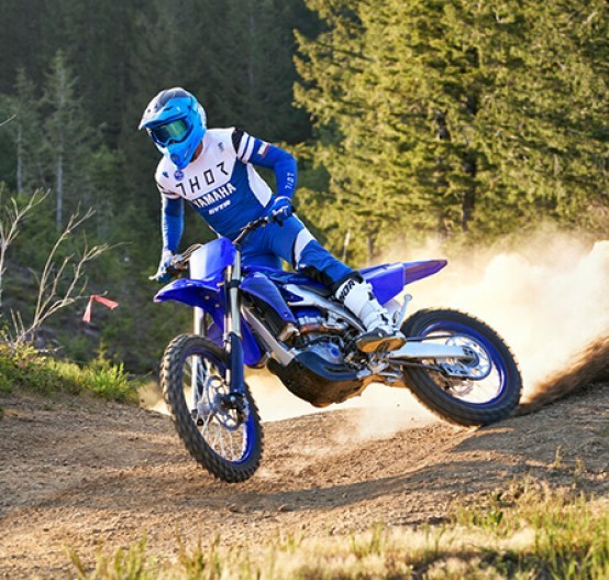 Action image of Yamaha YZ450FX in Blue colourway, big roost