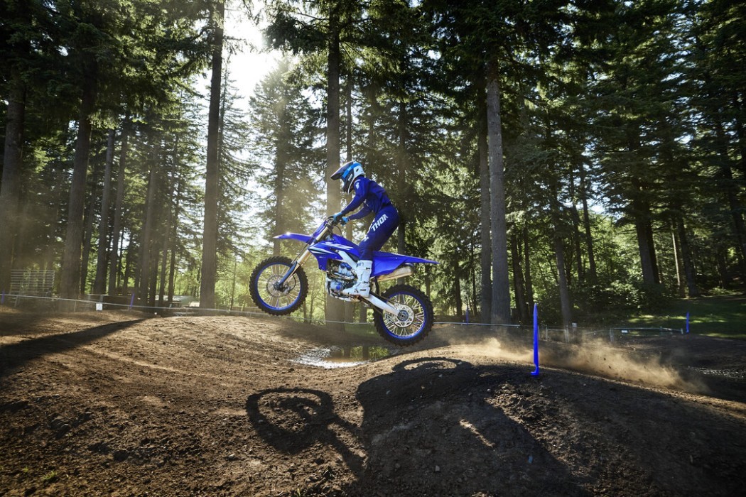 YZ250F 2025 static image of motocross bike jumping through whoop section