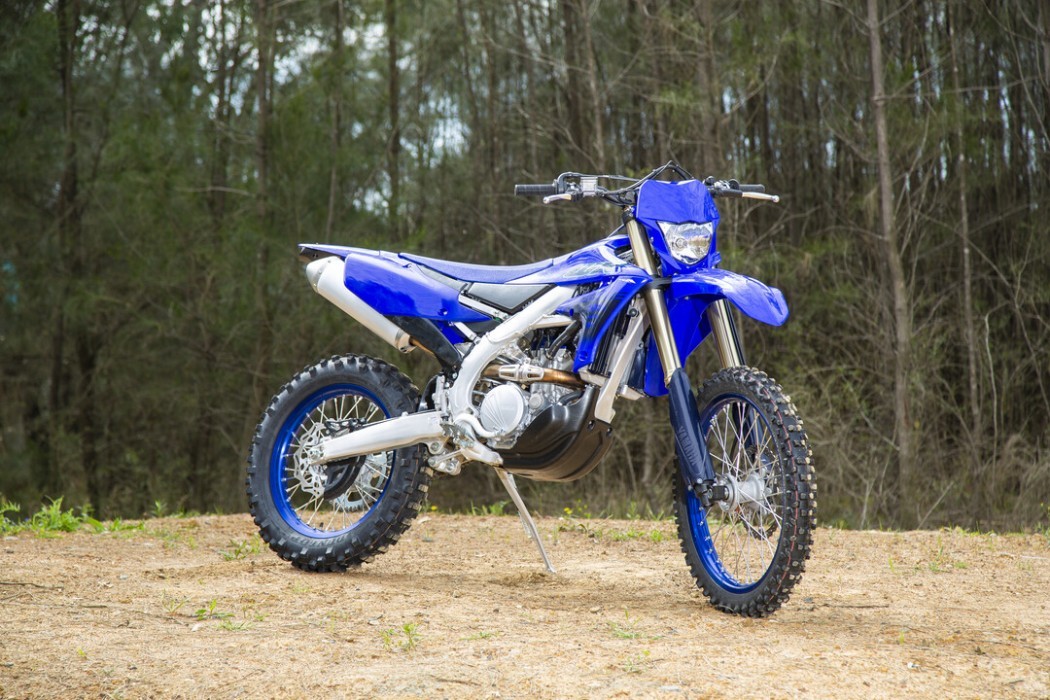 Static image of Yamaha WR250F 2024 in blue colourway, front three quarter outdoors