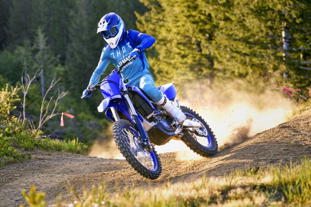Action image of Yamaha YZ250FX in Blue colourway, dirt trail
