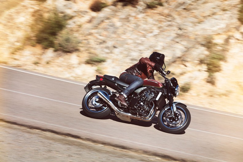 Action shot of Kawasaki Z900RS side on through a sweeping bend