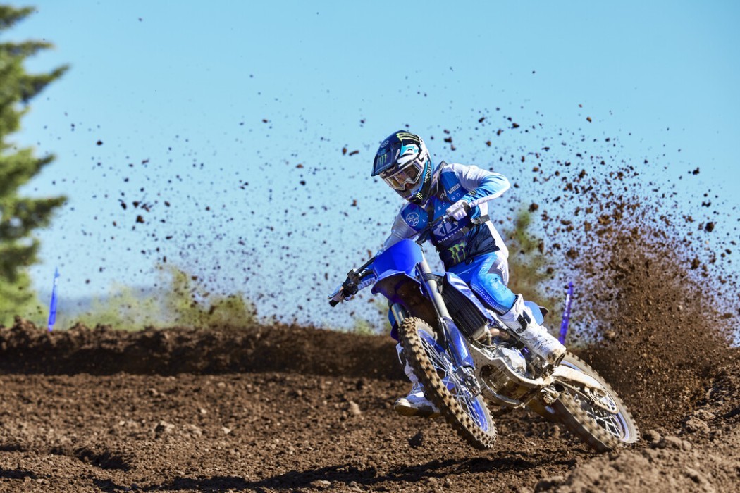 YZ450F 2025 static image of motocross bike racing around corner