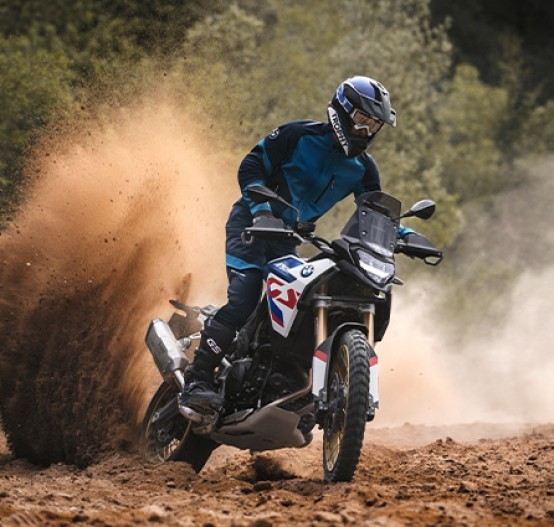 Riding off road on a BMW F 900 GS 2024 with dirt flicking up off the back wheel | Brisan Motorcycles Newcastle - Off Road Adventure travel motorcycle