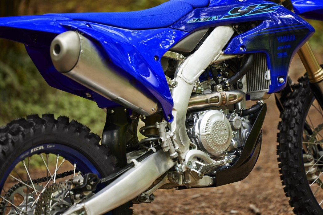 Detail image of Yamaha YZ450FX in Blue colourway, rear guard, exhaust pipe and engine