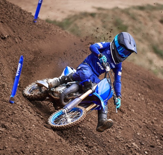 Action image of Yamaha YZ65 in Blue colourway, roost left hand corner