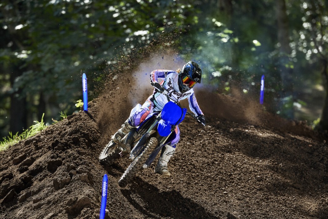 YZ125 2025 static image of motocross bike racing around a corner