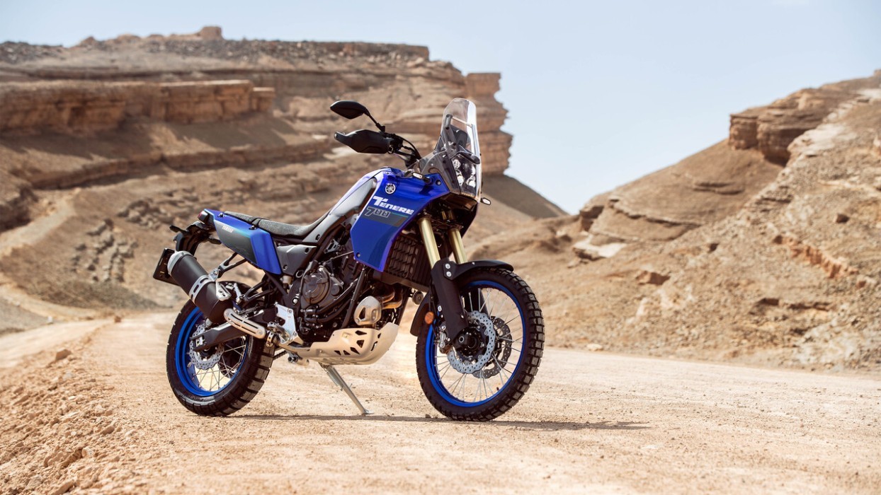 Static image of Yamaha Tenere 700 in Blue Colourway, front three quarter desert landscape