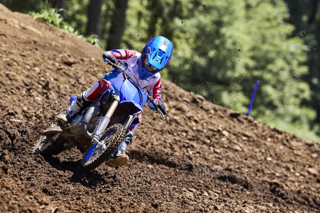 YZ65 2025 static image of motocross bike racing around corner