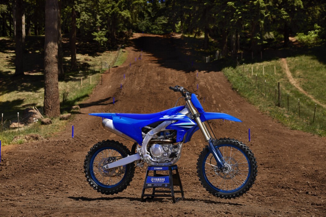 YZ450F 2025 static image of motocross bike on stand on track