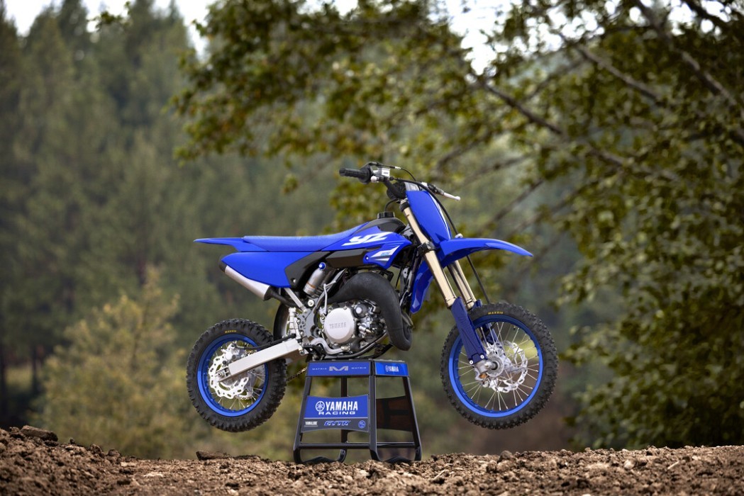 YZ65 2025 static image of motocross bike on stand on track