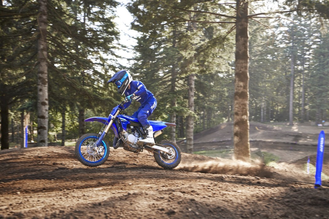 YZ65 2025 static image of motocross bike riding over jump