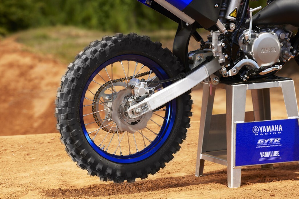 Detail image of Yamaha YZ85 two stroke in Blue colourway, rear wheel and swingarm