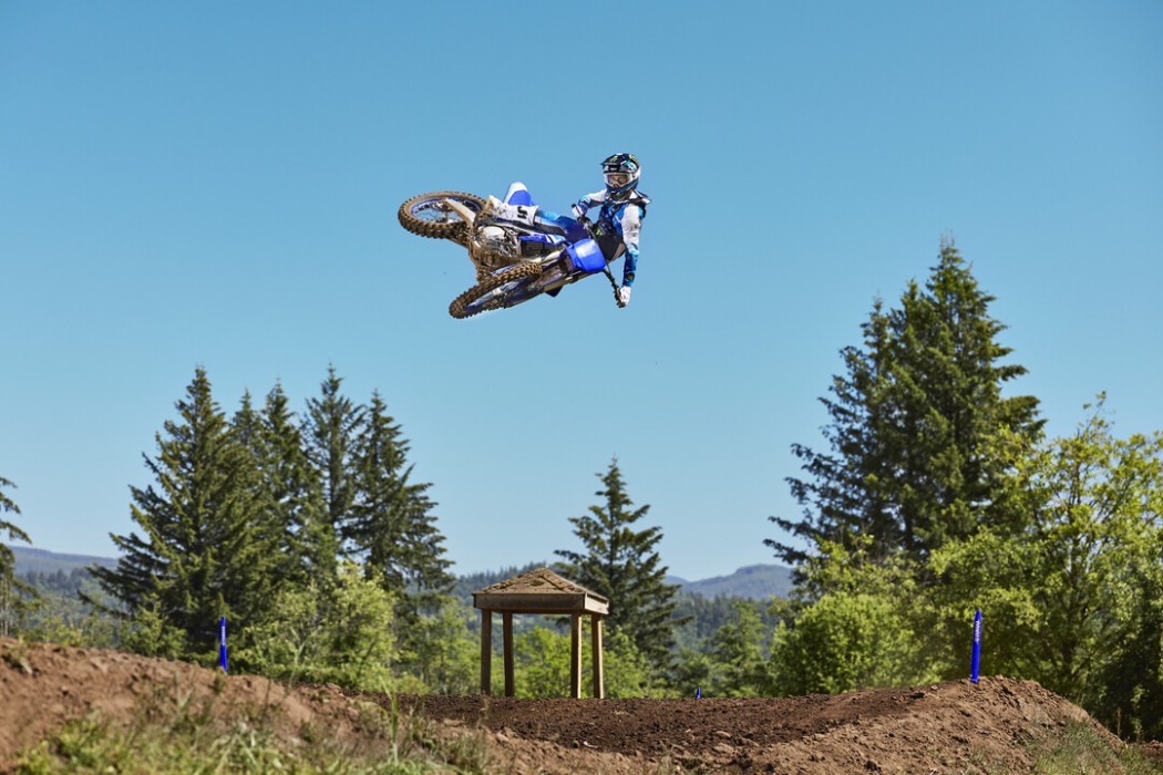 YZ250F 2025 static image of motocross bike doing big whip over jump