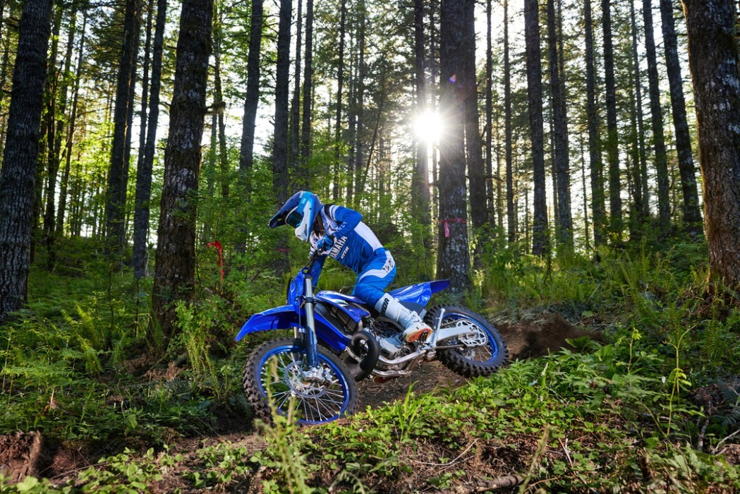 YZ250X 2025 static image of enduro bike racing around corner