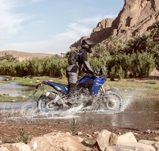 Action image of Yamaha Tenere 700 in Blue Colourway, side on river crossing