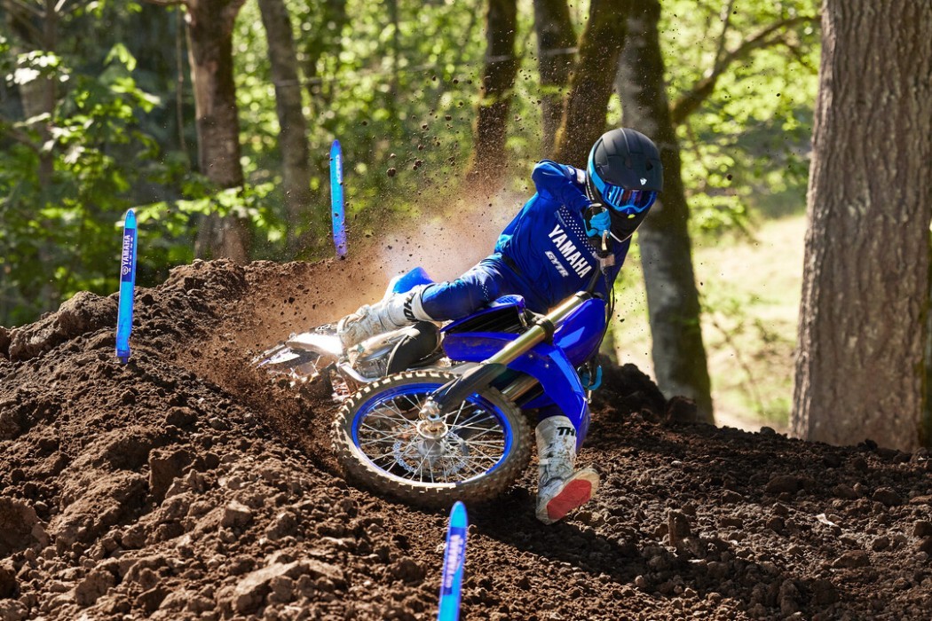 YZ125 2025 static image of motocross bike racing around a corner