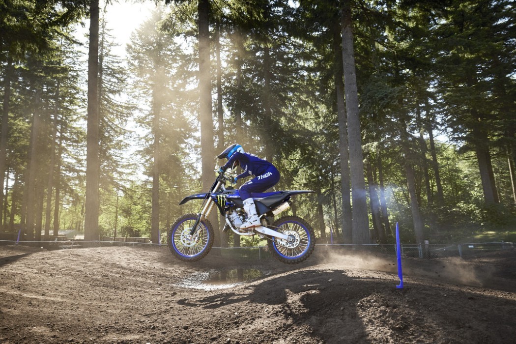 YZ125SP 2025 static image of motocross bike riding through whoop section