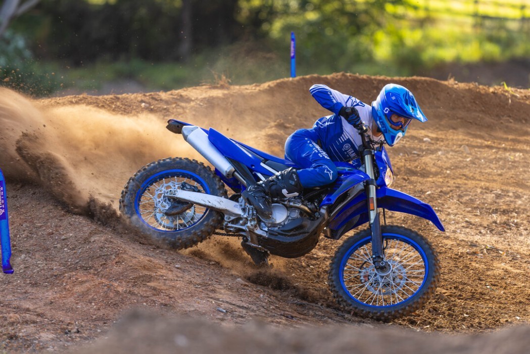 Action image of Yamaha WR250F 2024 in blue colourway, big roost berm