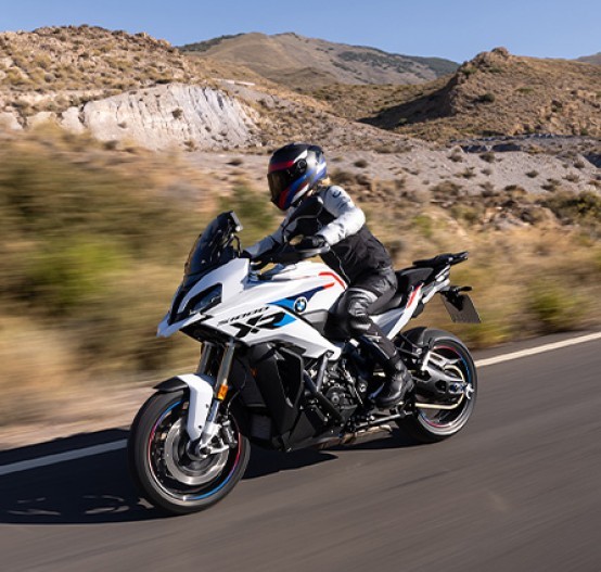 Action image of BMW S 1000 XR 2024 in Light White/M Motorsport colourway