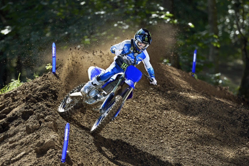 YZ450F 2025 static image of motocross bike racing around corner